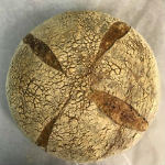A loaf of housemade sourdough bread from Organico