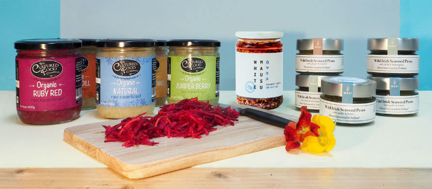 Jars of The Cultured Food Company kraut, White Mausu Peanut Rayu, and WASi Seaweeds pesto