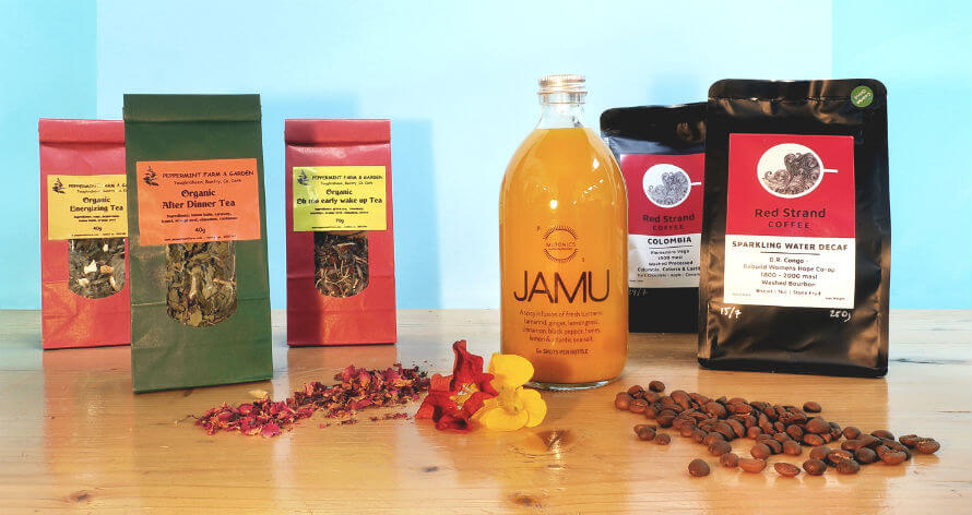 Bags of Red Strand Coffee and Peppermint Farm Tea and a bottle of MuTonics JAMU