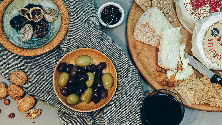 Cheeseboard and glass of organic wine