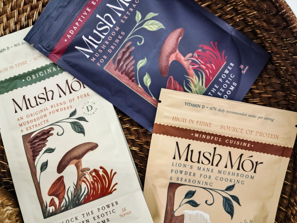 Three packets of Mush Mor adaptogenic mushroom powder.